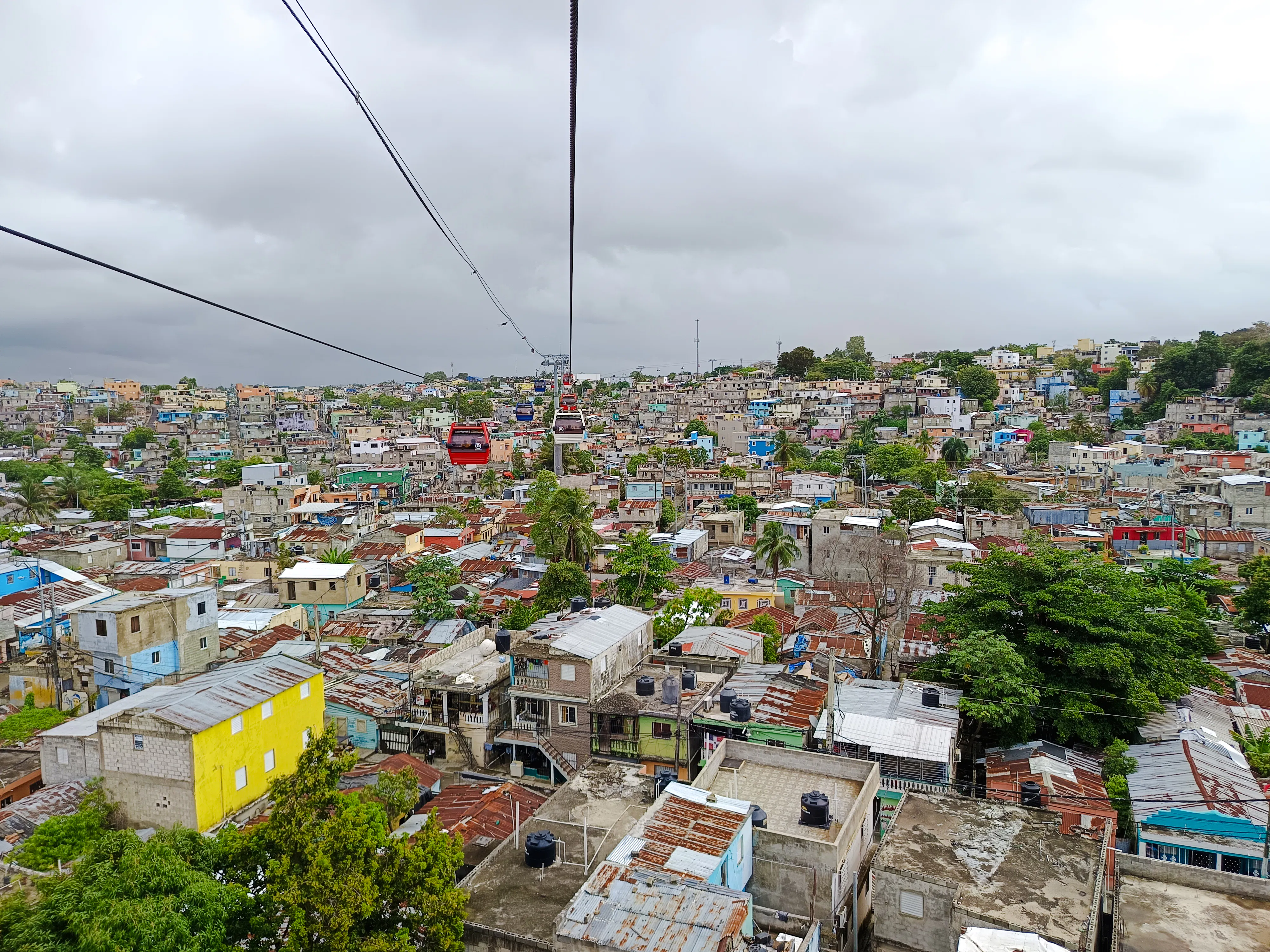Cable cars over Santo Domingo rooftops during city tour from Punta Cana.