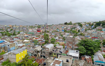 Cable cars over Santo Domingo rooftops during city tour from Punta Cana.