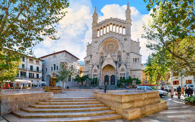 Stone church facade in Soller town square, Mallorca, part of Valldemossa and Soller tour.