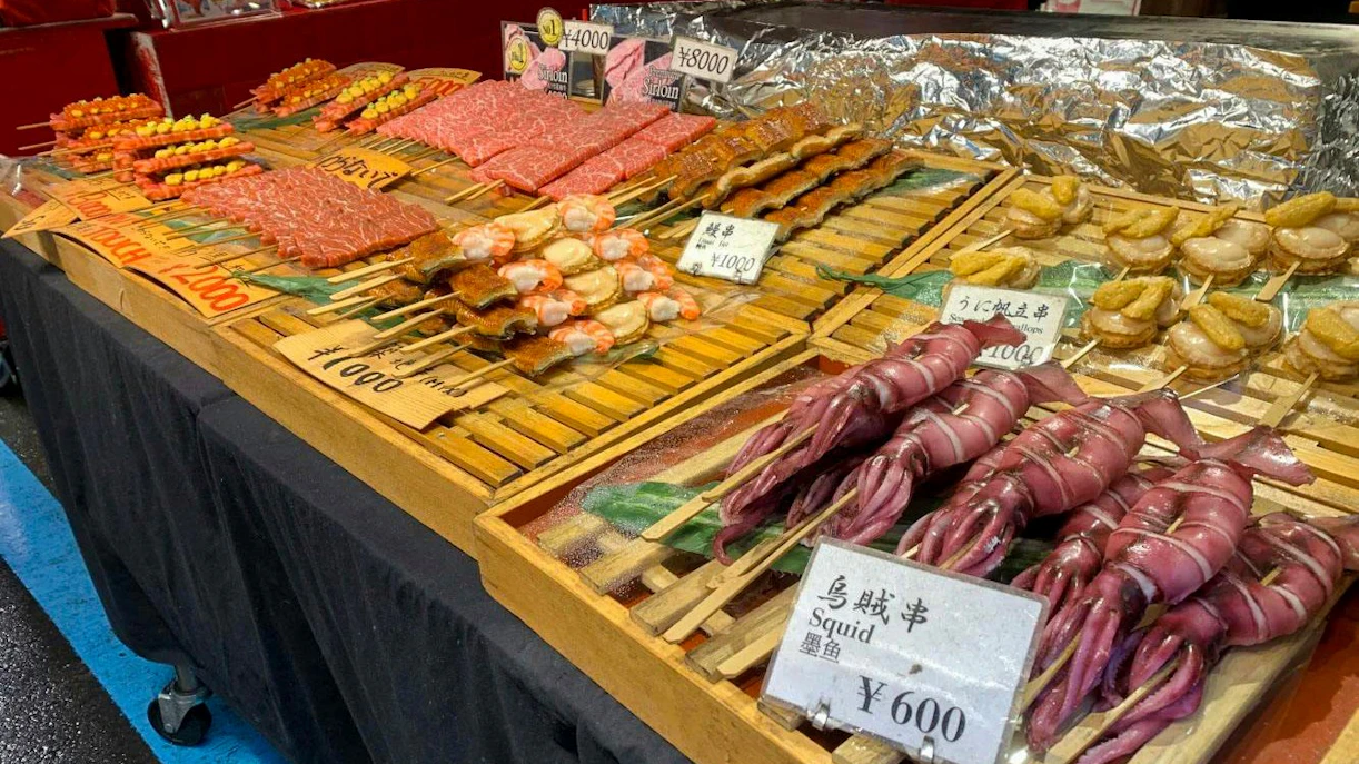 Seafood skewers including squid and scallops at Tsukiji Fish Market, Tokyo.
