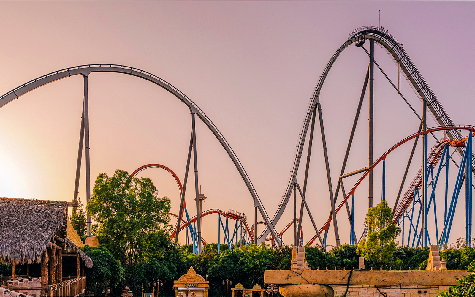 Roller coaster Dragon Khan at sunset in PortAventura Park, Spain.