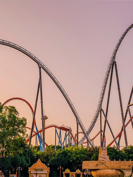 Roller coaster Dragon Khan at sunset in PortAventura Park, Spain.