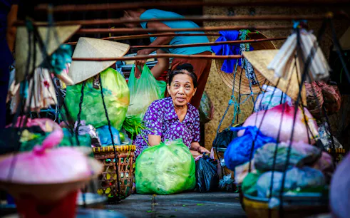 Street vendor with produce on Saigon food tour, Ho Chi Minh City.