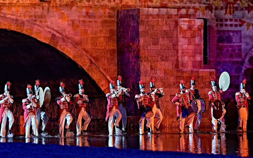 Performers in historical costumes playing instruments during The Dream of Toledo Night Show.