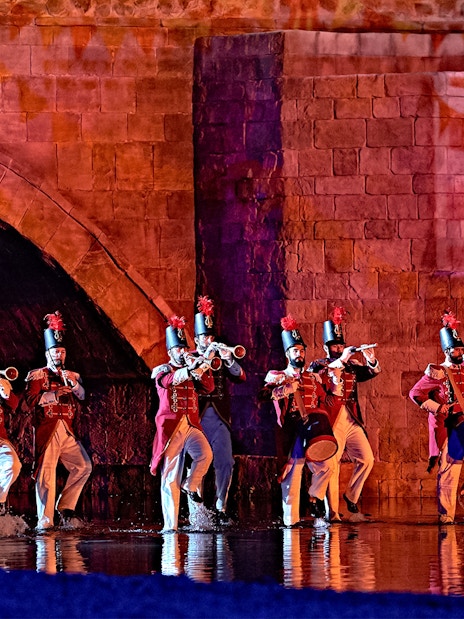 Performers in historical costumes playing instruments during The Dream of Toledo Night Show.