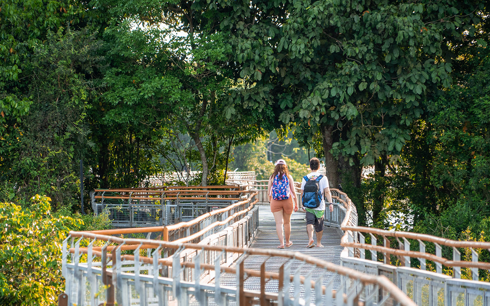 Tourists waling on trails to iguazu falls
