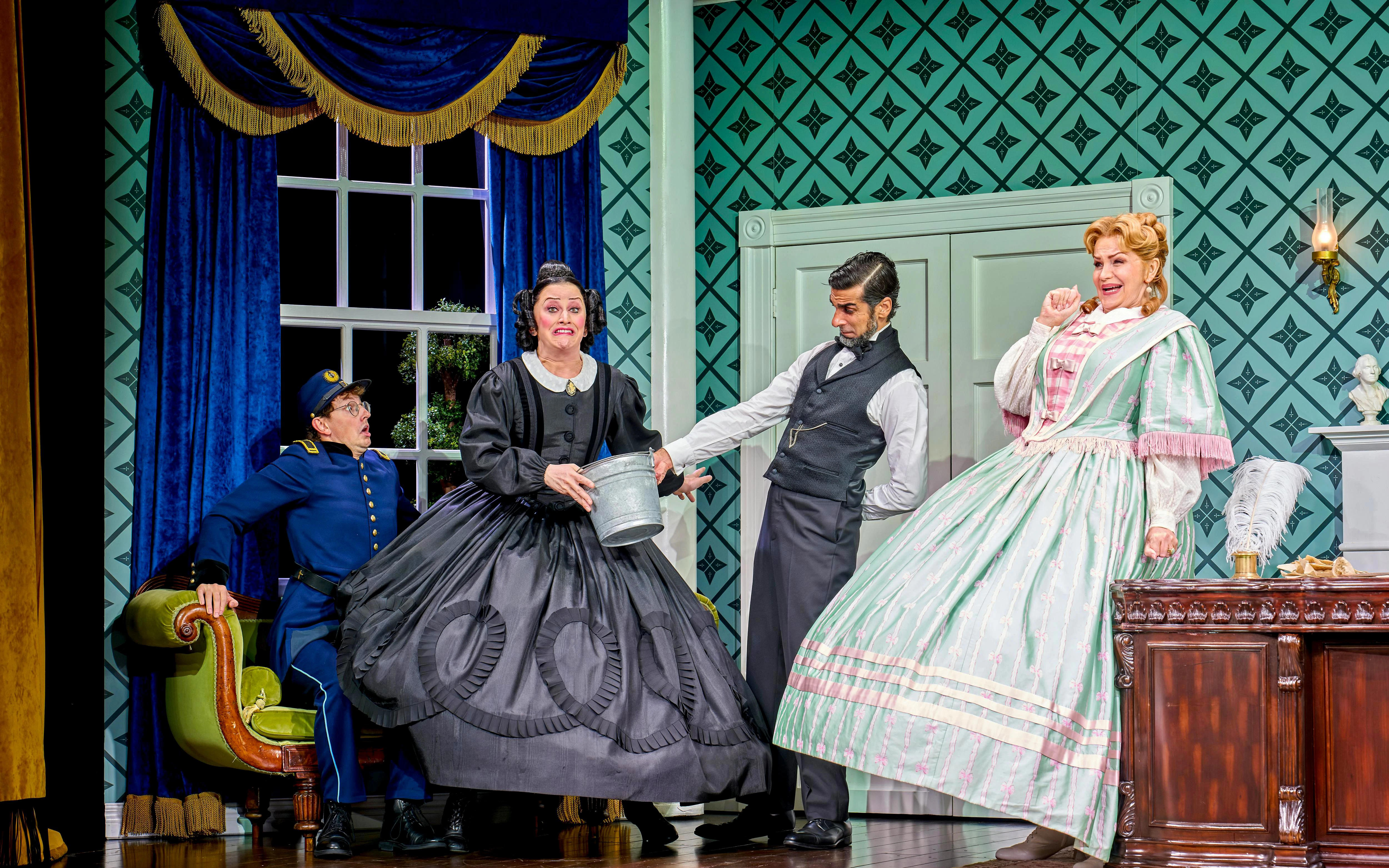 Actors in period costumes performing a comedic scene in "Oh Mary!" stage play.