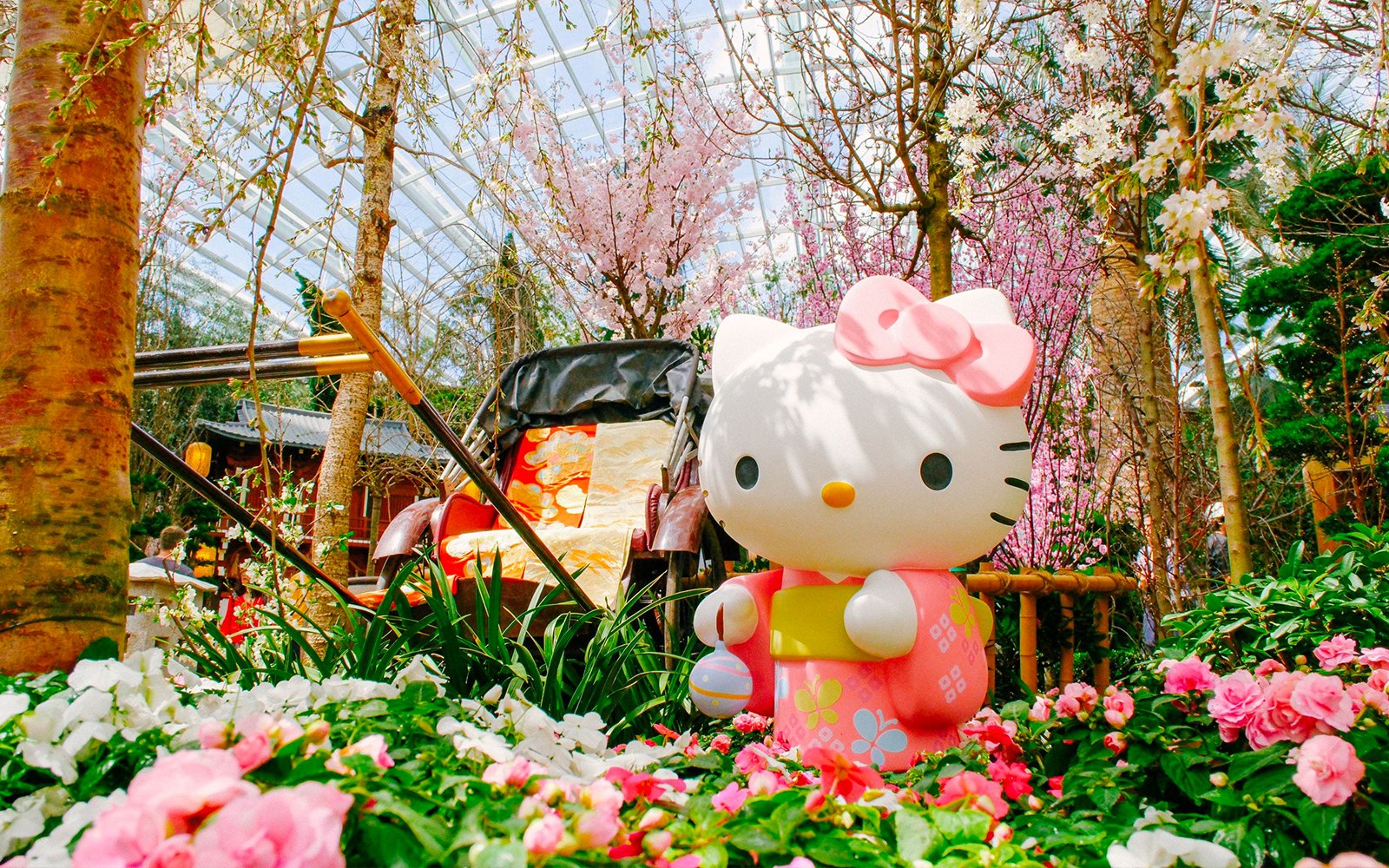 Hello Kitty statue among cherry blossoms at Gardens by the Bay Sakura event.