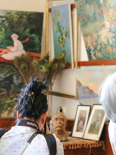 Visitors viewing paintings at Claude Monet’s home and gardens in Giverny.