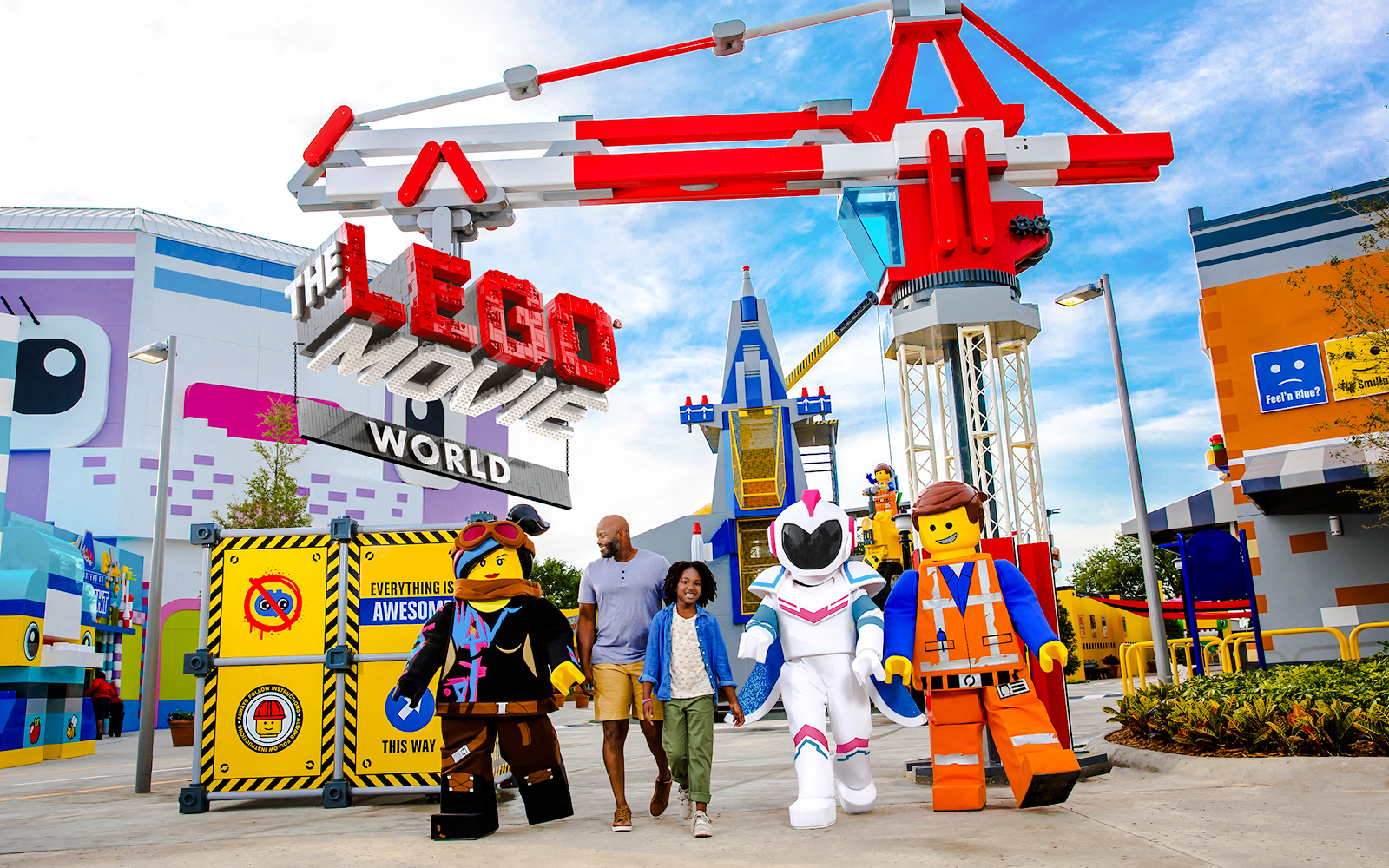 Family walking with LEGO characters at The LEGO Movie World, LEGOLAND® California.