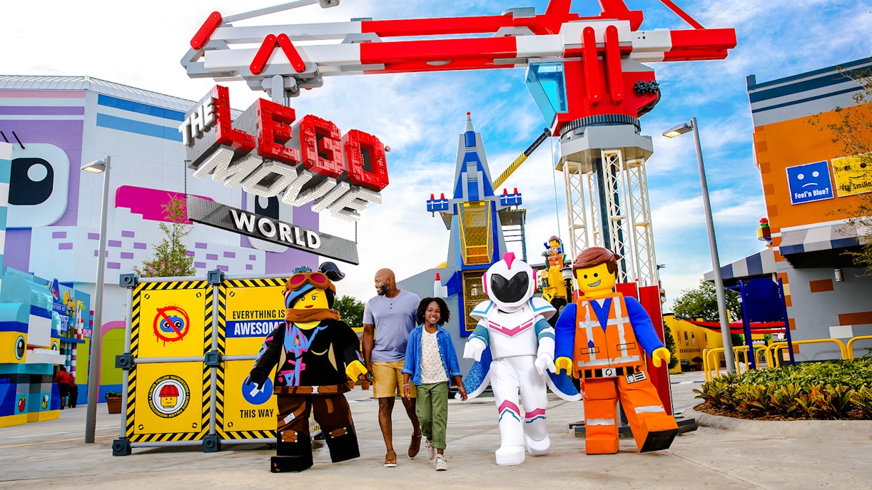 Family walking with LEGO characters at The LEGO Movie World, LEGOLAND® California.