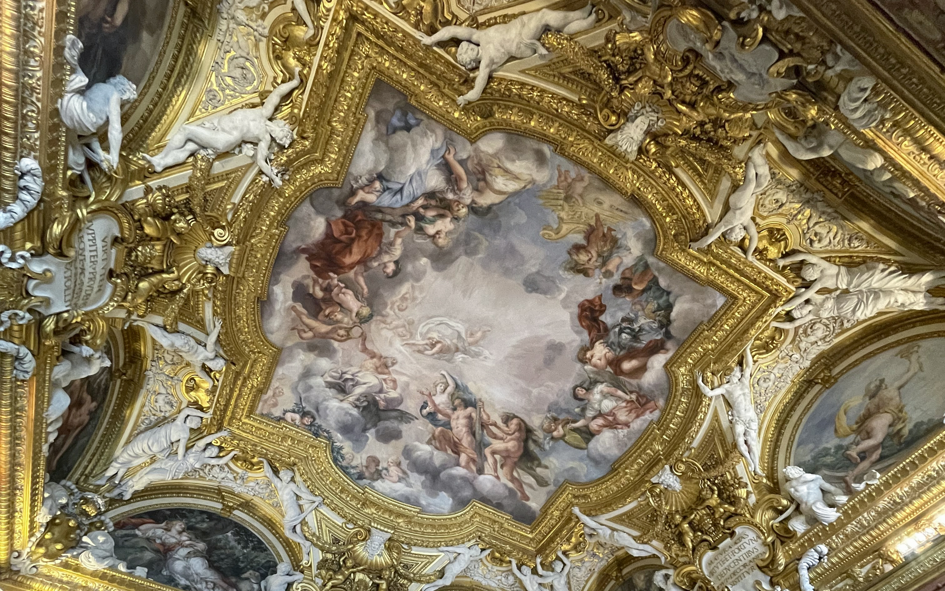 Pitti Palace ceiling frescoes depicting mythological figures in Florence, Italy.