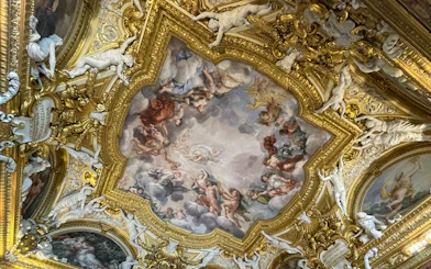 Pitti Palace ceiling frescoes depicting mythological figures in Florence, Italy.