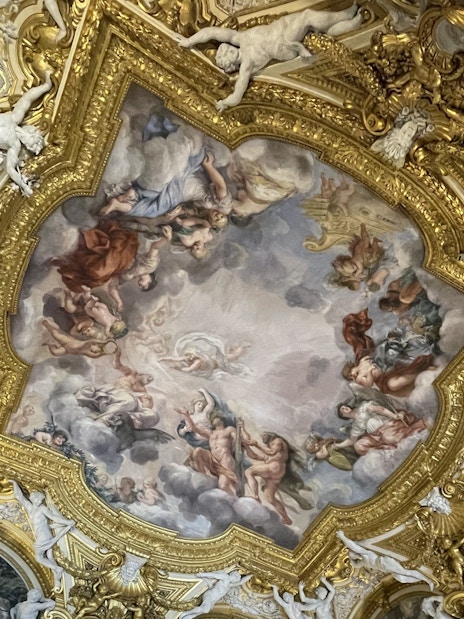 Pitti Palace ceiling frescoes depicting mythological figures in Florence, Italy.