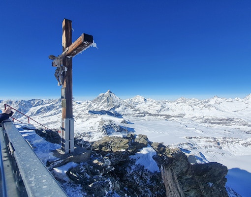 Viewing platform at Matterhorn Glacier Paradise with snowy mountain panorama.