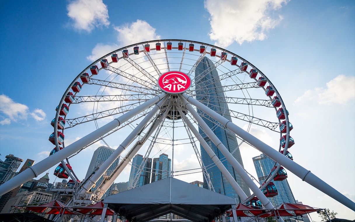 Hong Kong Observation Wheel with city skyscrapers in the background.