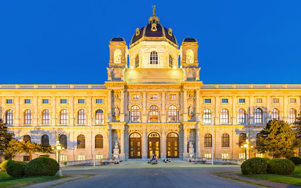 Kunsthistorisches Museum exterior illuminated in evening, Vienna.