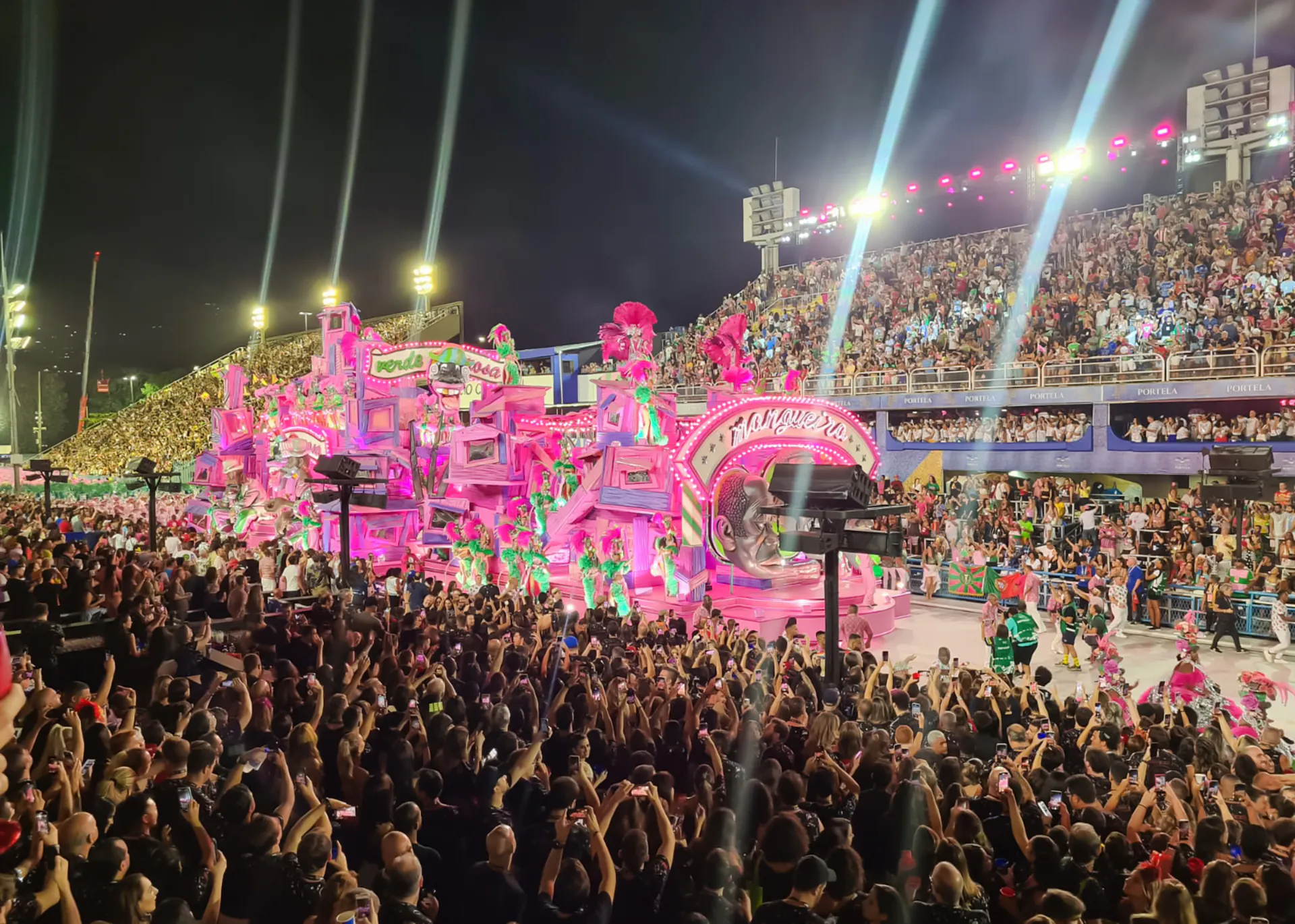 Carnival parade with vibrant floats and dancers at Marquês de Sapucaí, Rio de Janeiro.
