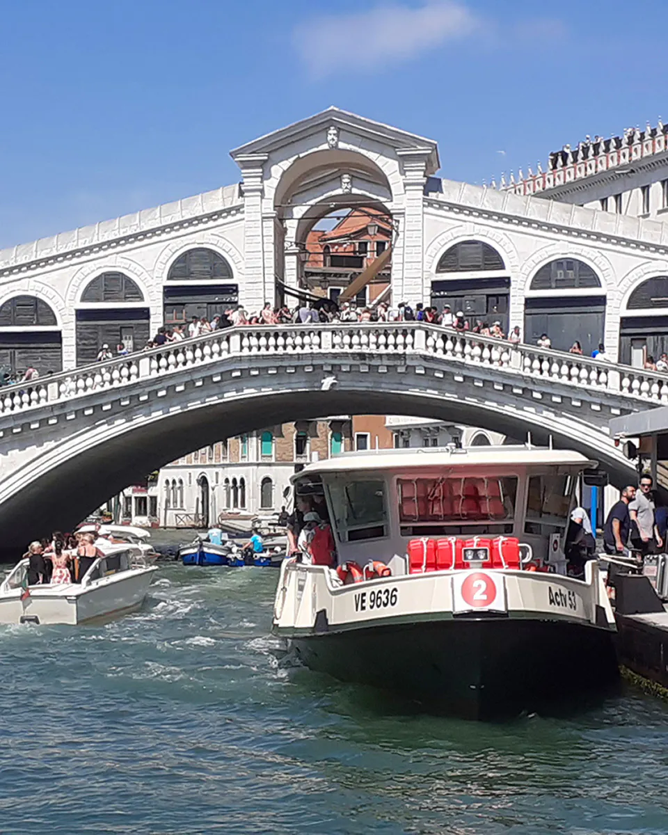 Venice ACTV water taxi near Rialto Bridge on the Grand Canal.