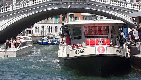 Venice ACTV water taxi near Rialto Bridge on the Grand Canal.