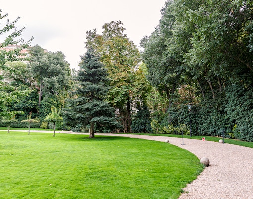 Liria Palace garden with manicured hedges and historic architecture in Madrid, Spain.
