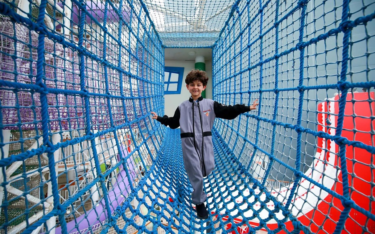 Child navigating rope bridge at CITY STUDIO, Angry Birds World Theme Park.