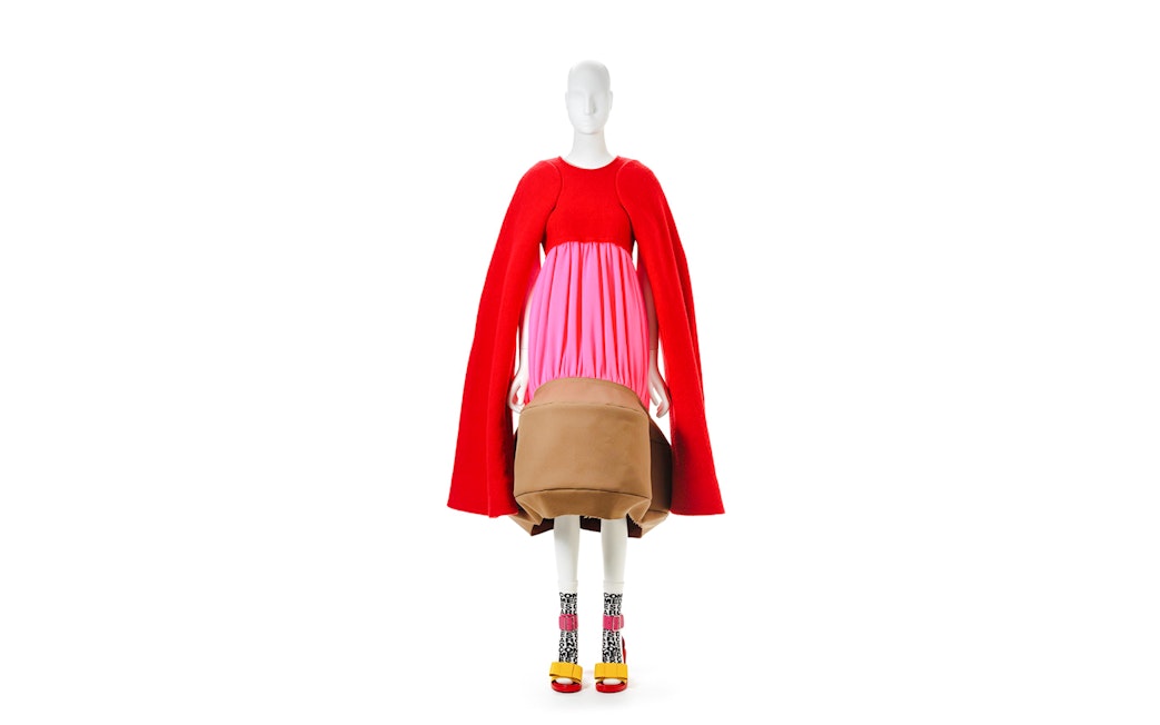 Mannequin in avant-garde red and pink dress by Kawakubo at NGV Westwood exhibition.
