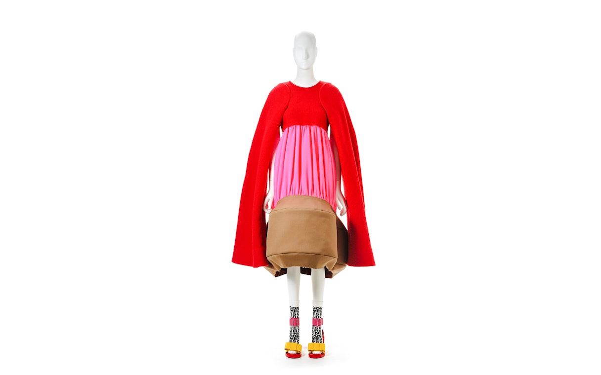 Mannequin in avant-garde red and pink dress by Kawakubo at NGV Westwood exhibition.