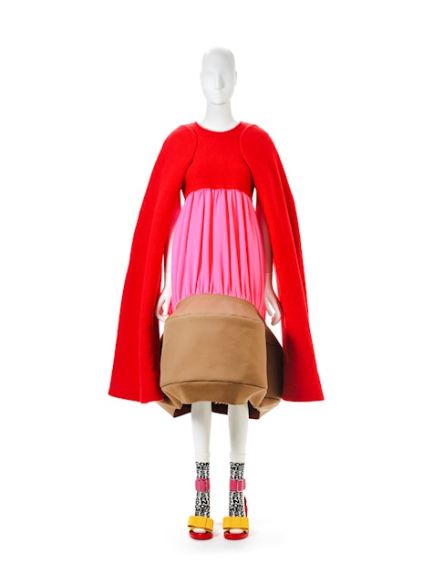 Mannequin in avant-garde red and pink dress by Kawakubo at NGV Westwood exhibition.