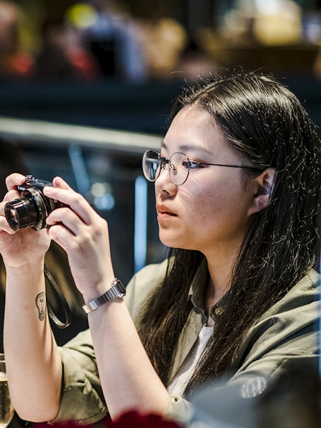 Guests enjoying high tea with pastries at National Gallery of Victoria.