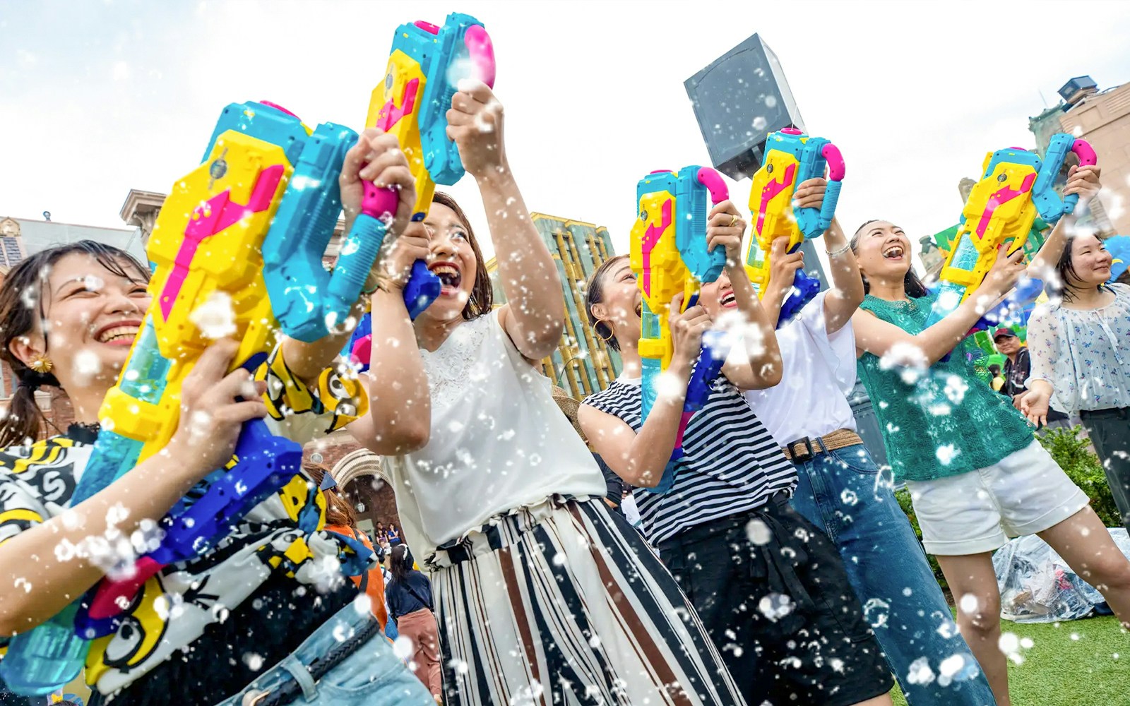 Visitors enjoying water gun fun at Summer Splash Parade, Universal Studios Japan.