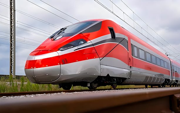 High-speed train on tracks for Barcelona Sants to Madrid Atocha route.