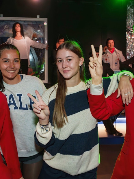 Visitors posing with wax figures at the National Wax Museum.
