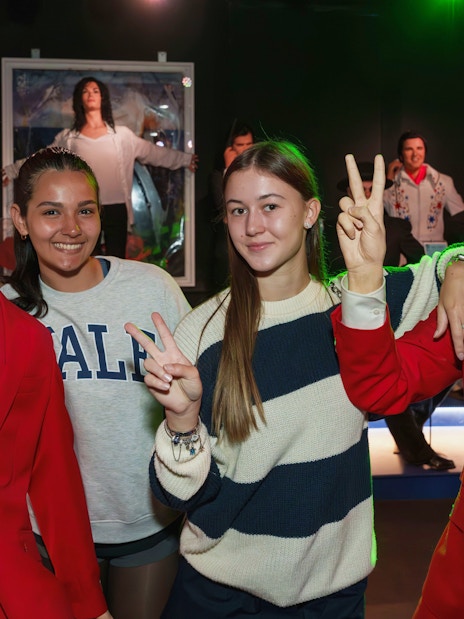 Visitors posing with wax figures at the National Wax Museum.