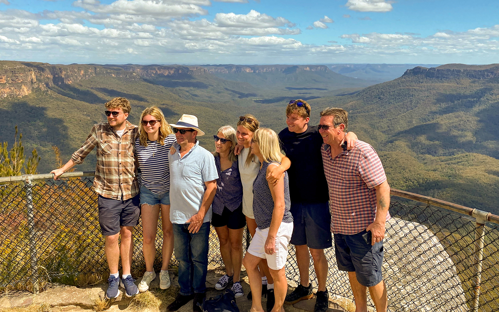 Tourists posing at a viewpoint overlooking Jamison Valley, Blue Mountains