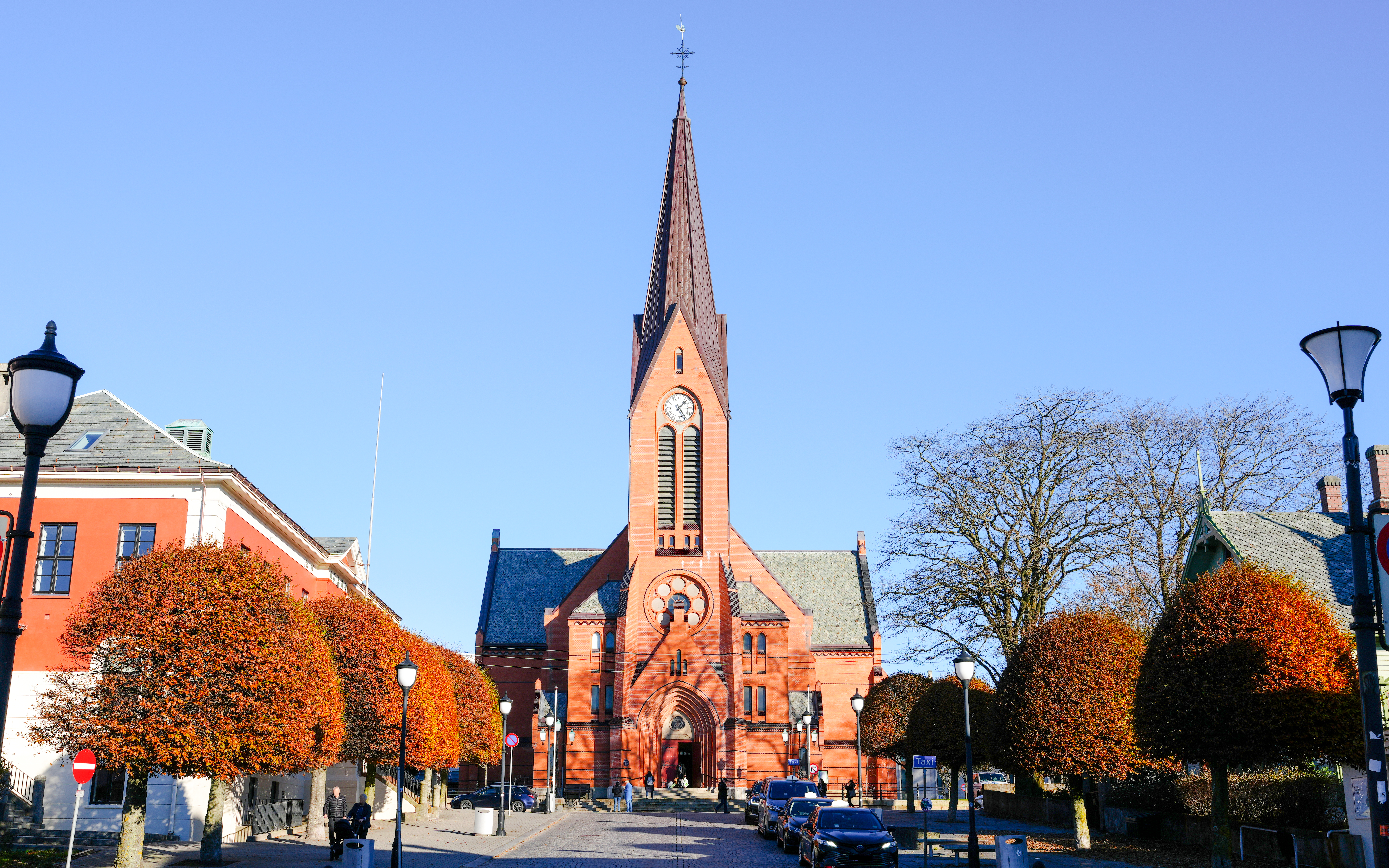 Rote Kirche in Haugesund under a clear blue sky, Norway.