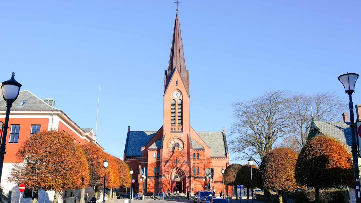 Rote Kirche in Haugesund under a clear blue sky, Norway.