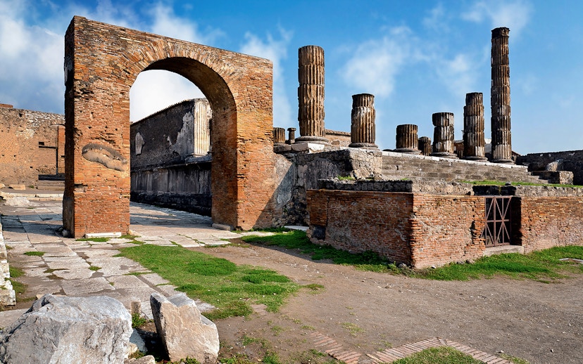 Ancient ruins and columns in Pompeii, Italy, part of a skip-the-line guided tour.
