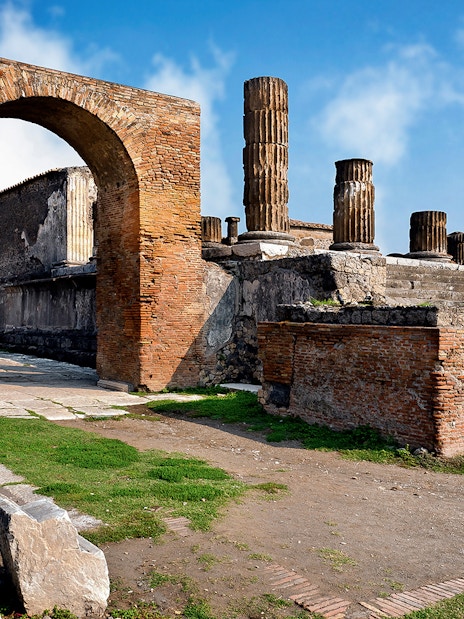 Ancient ruins and columns in Pompeii, Italy, part of a skip-the-line guided tour.