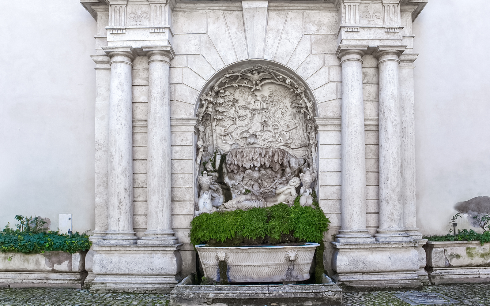 Fountain of Venus at Villa d'Este, Tivoli, Italy, surrounded by lush gardens.