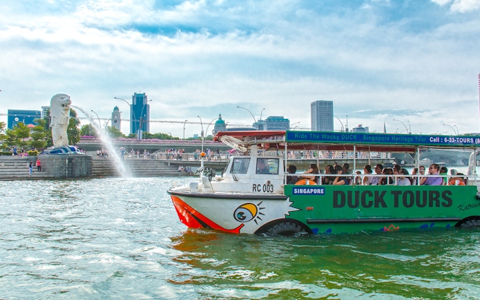 DUCKtour boat on Singapore River near Merlion Fountain.