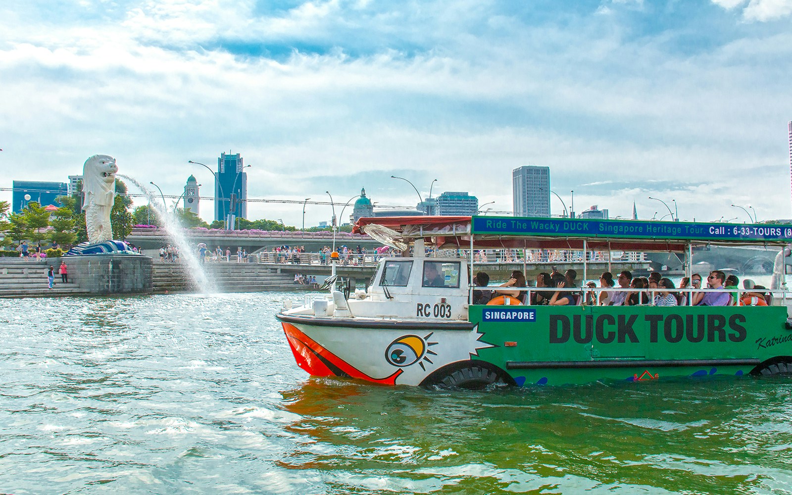 DUCKtour boat on Singapore River near Merlion Fountain.