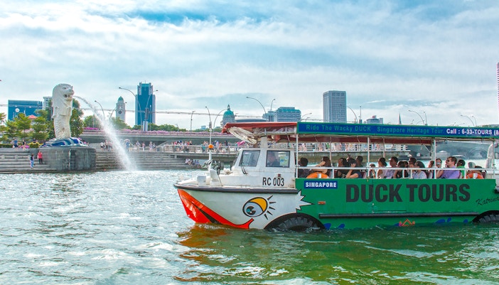 DUCKtour boat on Singapore River near Merlion Fountain.