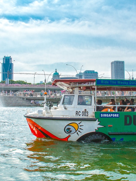 DUCKtour boat on Singapore River near Merlion Fountain.