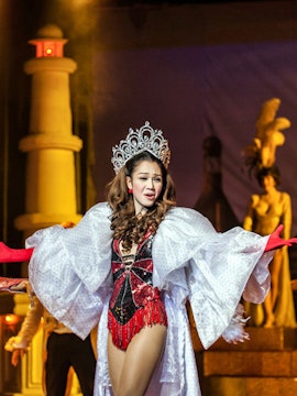 Performer in elaborate costume at Golden Dome Cabaret, Bangkok stage show.