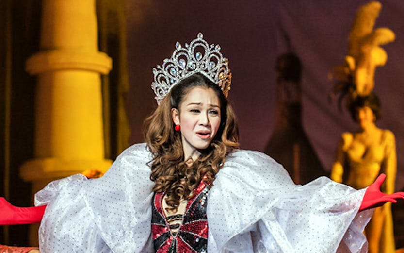 Performer in elaborate costume at Golden Dome Cabaret, Bangkok stage show.