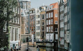 Canal-side buildings and bridge in Amsterdam's Red Light District.