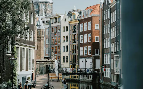 Canal-side buildings and bridge in Amsterdam's Red Light District.