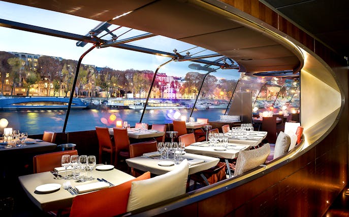 Bateaux Parisiens dining area with Seine River view, Paris New Year’s Eve 2025.