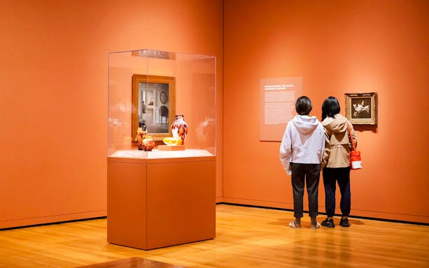 Visitors viewing art exhibits at Seattle Art Museum.